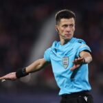 Referee Benoit Bastien gestures during the UEFA Champions League 2024/25 League Phase MD6 match between Girona FC and Liverpool FC at Montilivi Stadium on December 10, 2024 in Girona, Spain