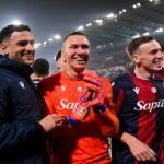 Nadir Zortea, Lukasz Skorupski, and Lewis Ferguson of Bologna celebrate victory in the UEFA Europa League 2025/26 Knockout Play-off Second Leg match between Bologna FC 1909 and SK Brann at Stadio Renato Dall'Ara on February 26, 2026 in Bologna, Italy.