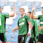 Doig esulta con i compagni