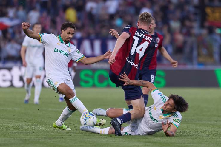 Paulo Dybala of AS Roma competes for the ball with Torbjorn Heggem of Bologna FC during the Serie A match between Bologna FC 1909 and AS Roma at Renato Dall'Ara Stadium on April 25, 2026 in Bologna, Italy.