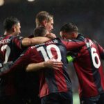 I calciatori del Bologna esultano dopo una vittoria