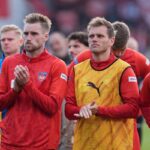 HEIDENHEIM, GERMANY - MAY 16: Patrick Mainka (L) and Tim Siersleben of 1. FC Heidenheim 1846 (R) look dejected following the team's defeat in the Bundesliga match between 1. FC Heidenheim 1846 and 1. FSV Mainz 05 at Voith-Arena on May 16, 2026 in Heidenheim, Germany.