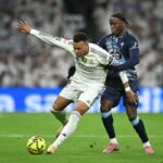 Kylian Mbappe of Real Madridis challenged by Ilaix Moriba of Celta Vigo during the LaLiga EA Sports match between Real Madrid CF and RC Celta de Vigo at Estadio Santiago Bernabeu on December 07, 2025 in Madrid, Spain.