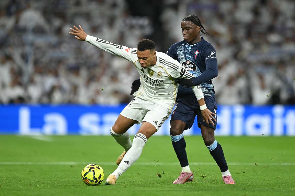 Kylian Mbappe of Real Madridis challenged by Ilaix Moriba of Celta Vigo during the LaLiga EA Sports match between Real Madrid CF and RC Celta de Vigo at Estadio Santiago Bernabeu on December 07, 2025 in Madrid, Spain.