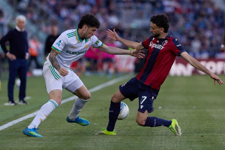  APRIL 25: Matías Soulé of AS Roma competes for the ball with Joao Mário of Bologna FC during the Serie A match between Bologna FC 1909 and AS Roma at Renato Dall'Ara Stadium on April 25, 2026 in Bologna, Italy. 