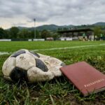 Un pallone sgonfio ed un passaporto - immagine generata da IA