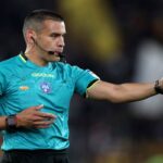 Referee Marco Piccinini gestures during the Serie A match between AS Roma and AC Milan at Stadio Olimpico on May 18, 2025 in Rome, Italy.