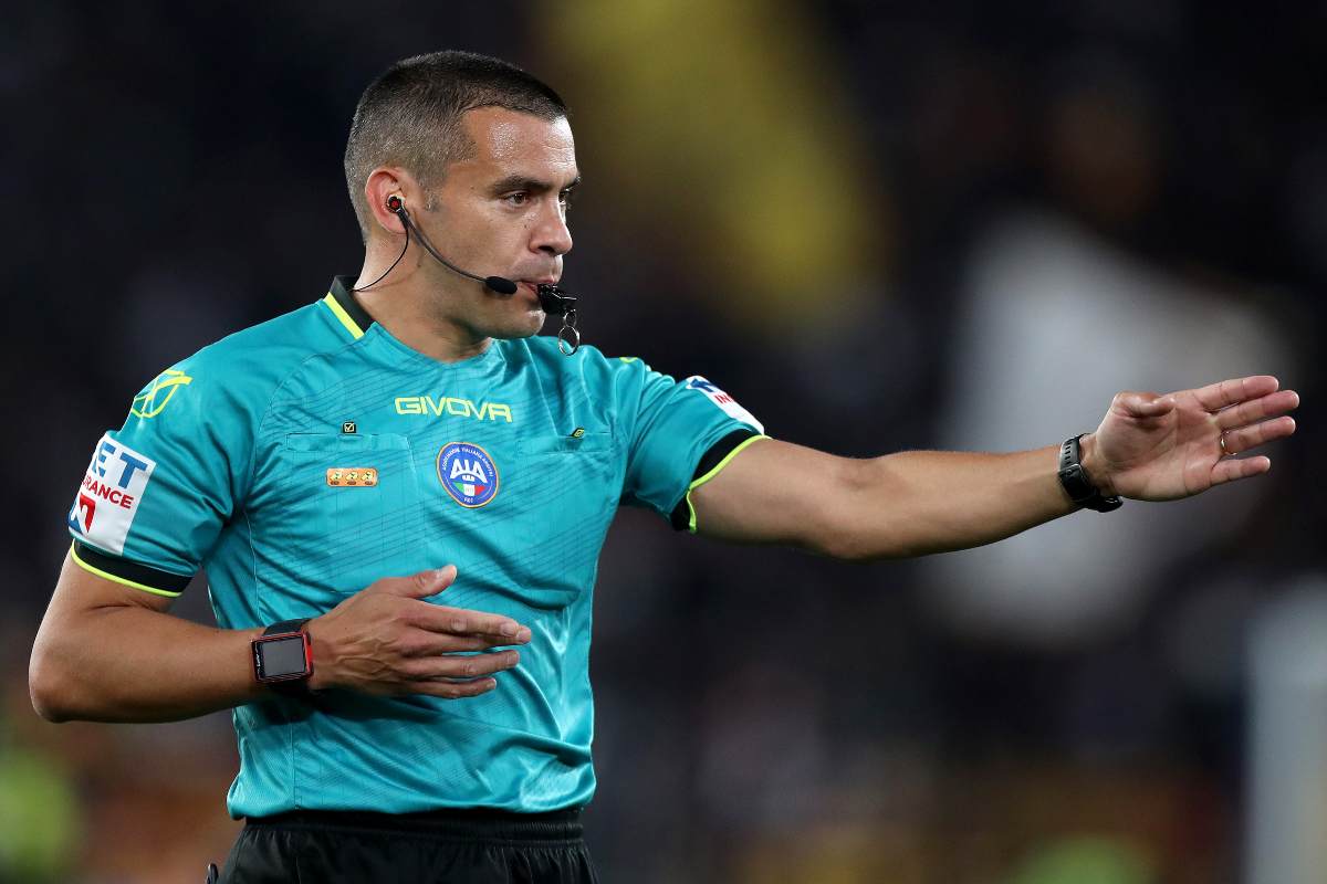 Referee Marco Piccinini gestures during the Serie A match between AS Roma and AC Milan at Stadio Olimpico on May 18, 2025 in Rome, Italy.