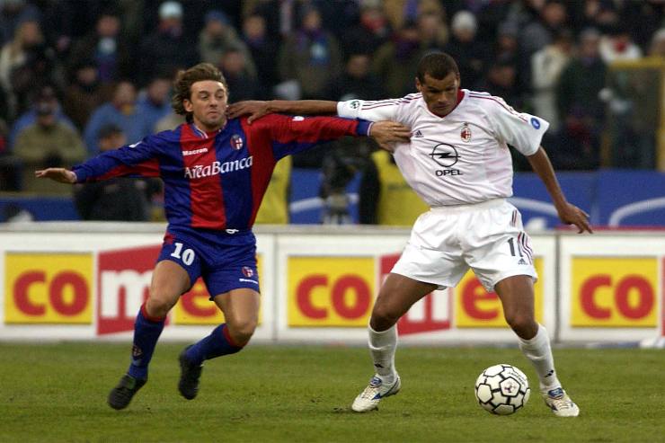 Rivaldo of AC Milan and Giuseppe Signori of Bologna in action during the Serie A match between Bologna and AC Milan, played at the Renato Dall'Ara Stadium, Bologna, Italy on January 14, 2003.