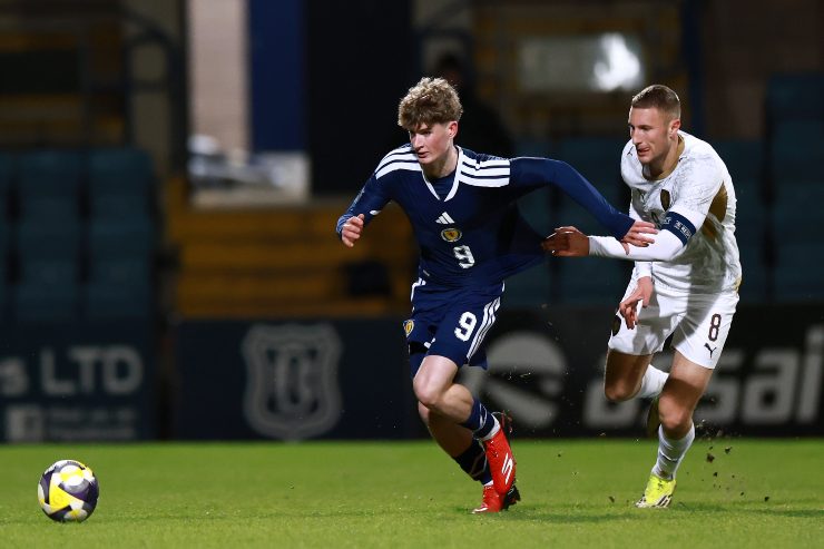 DUNDEE, SCOTLAND - MARCH 27: James Wilson of Scotland is challenged by Ondrej Kricfalusi of Czechia during the UEFA Under21 EURO Qualifier between Scotland U21 and Czechia U21 at Dens Park Stadium on March 27, 2026 in Dundee, Scotland.